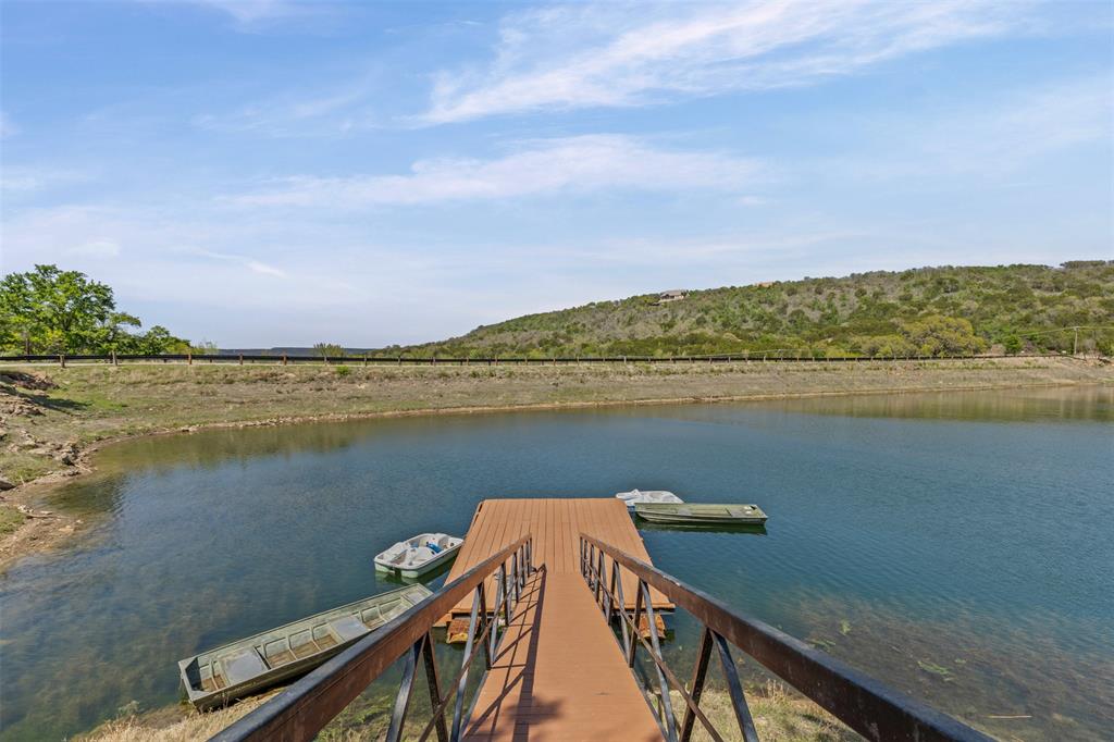 1060 Post Oak Road Gordon, TX 76453 - Photo 16 of 23 a view of a lake with a big yard