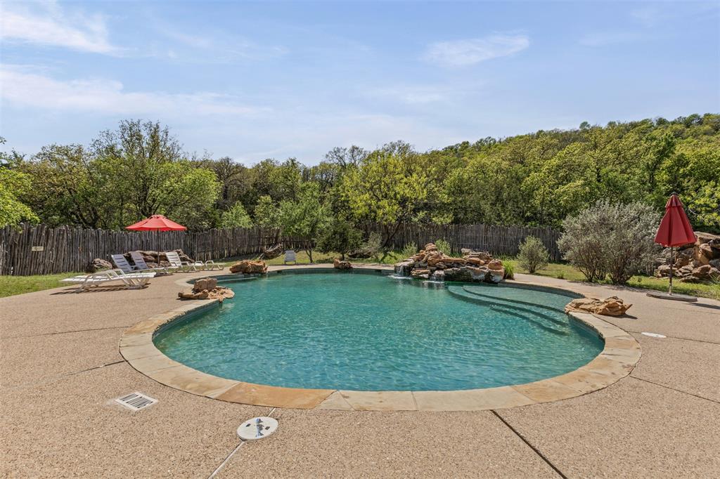 1060 Post Oak Road Gordon, TX 76453 - Photo 17 of 23 a view of a swimming pool with a sitting area