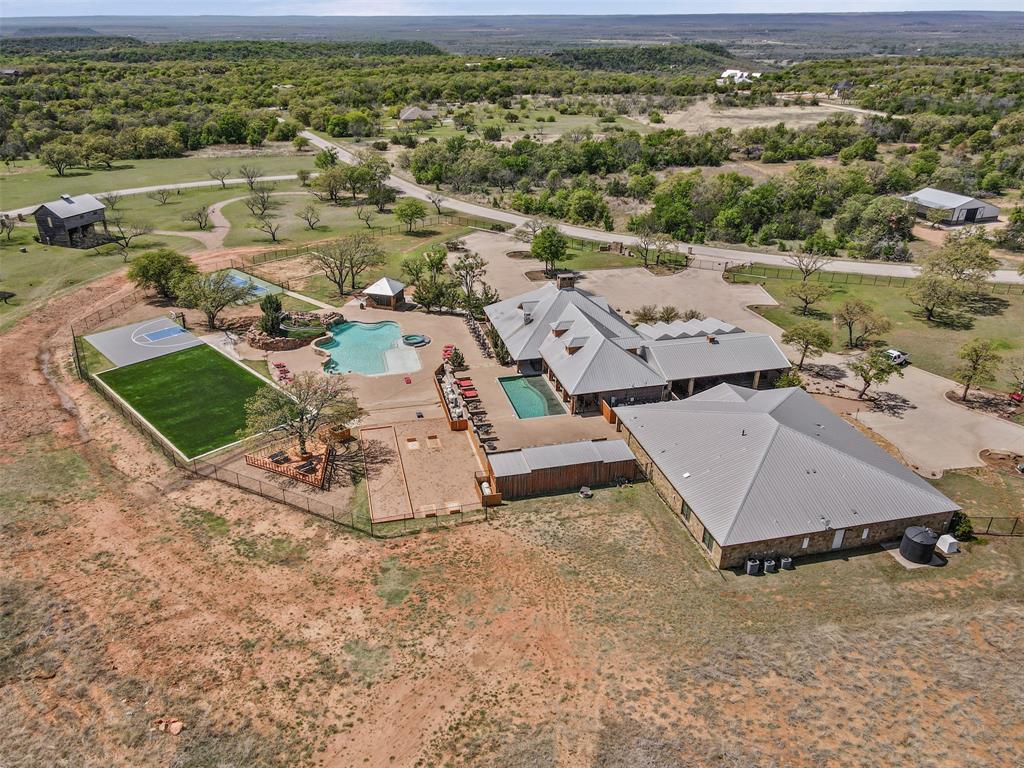 1060 Post Oak Road Gordon, TX 76453 - Photo 21 of 23 an aerial view of a house with a yard and lake view