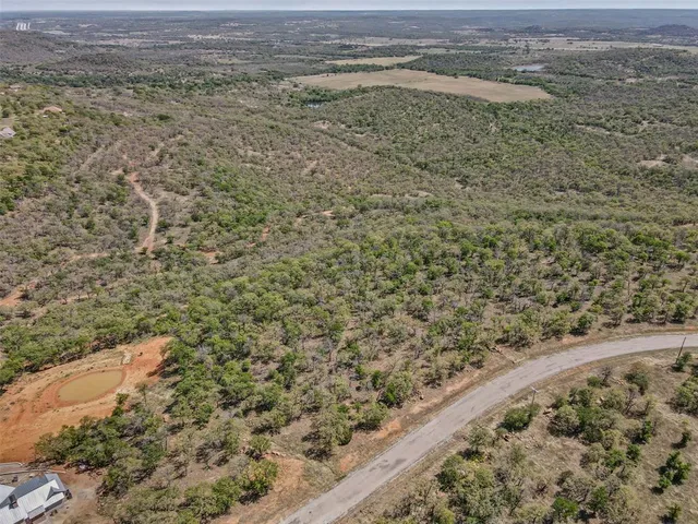 a view of a field with an ocean view