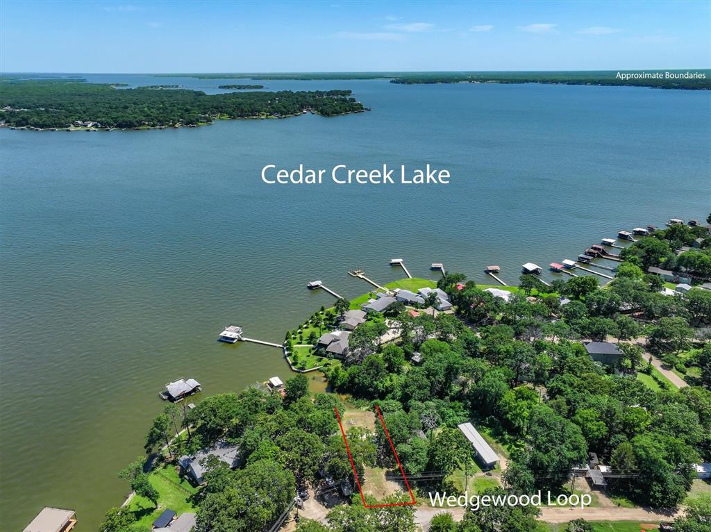 136 Wedgewood Loop Mabank, TX 75156 - Photo 2 of 12 a view of a lake with houses