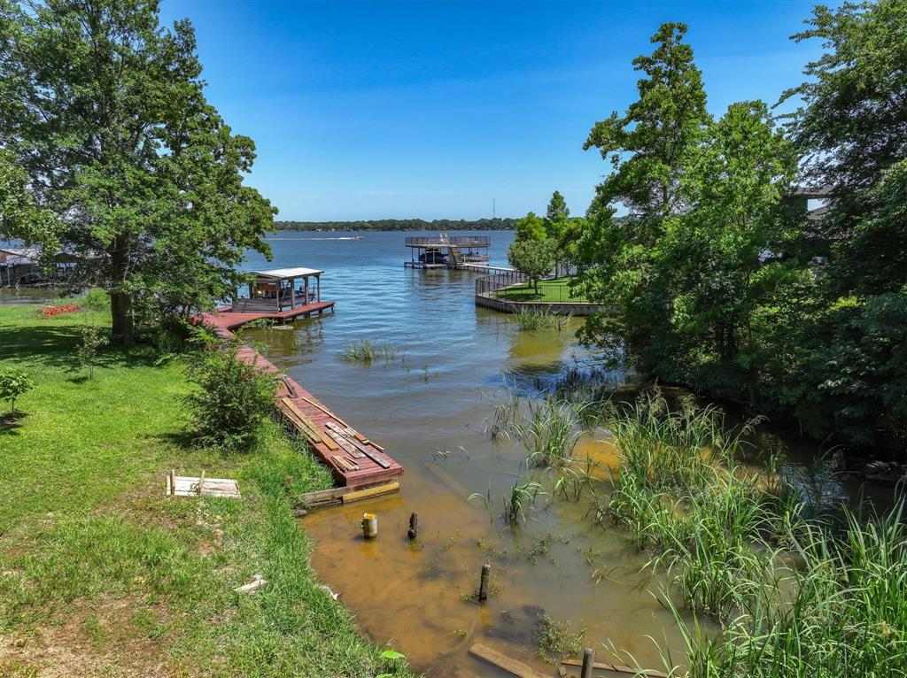 136 Wedgewood Loop Mabank, TX 75156 - Photo 8 of 12 a view of a house with a yard