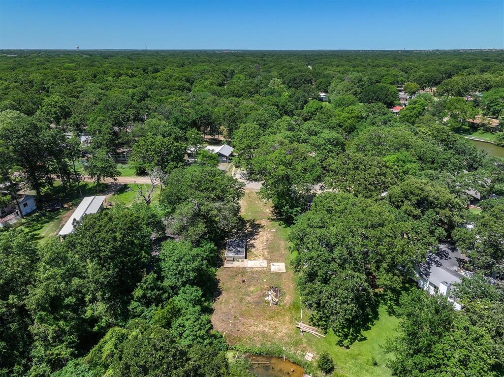 136 Wedgewood Loop Mabank, TX 75156 - Photo 9 of 12 an aerial view of residential houses with outdoor space and trees