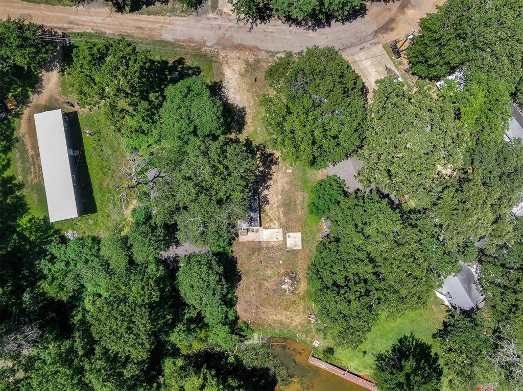 136 Wedgewood Loop Mabank, TX 75156 - Photo 10 of 12 an aerial view of residential house with outdoor space and trees all around