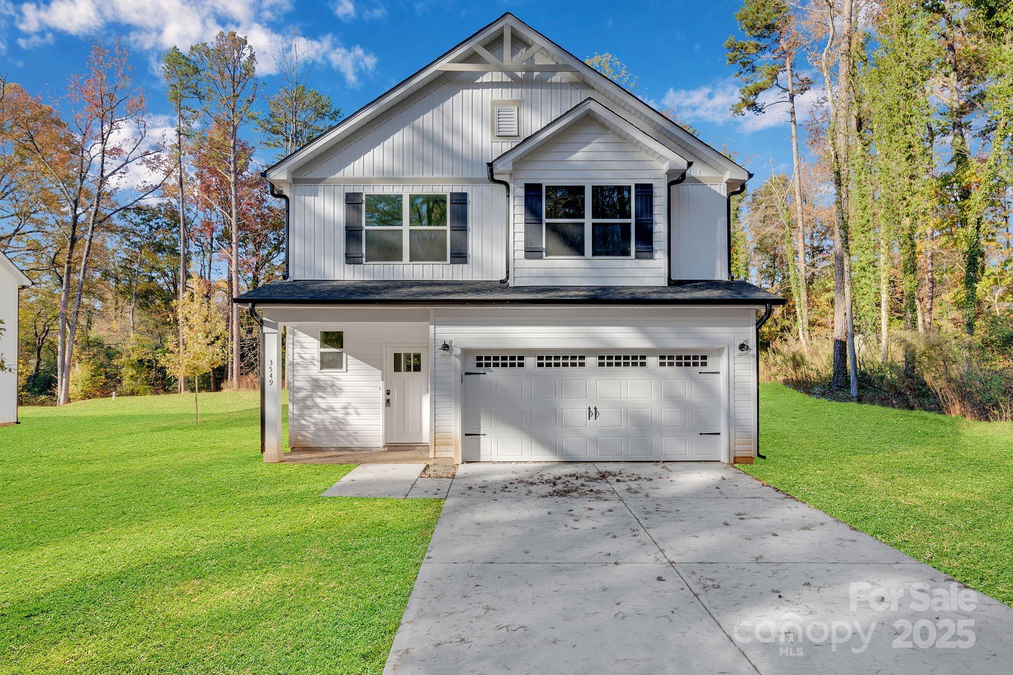 3549 Lake Road Charlotte, NC 28269 - Photo 1 of 34 a view of a house with a yard