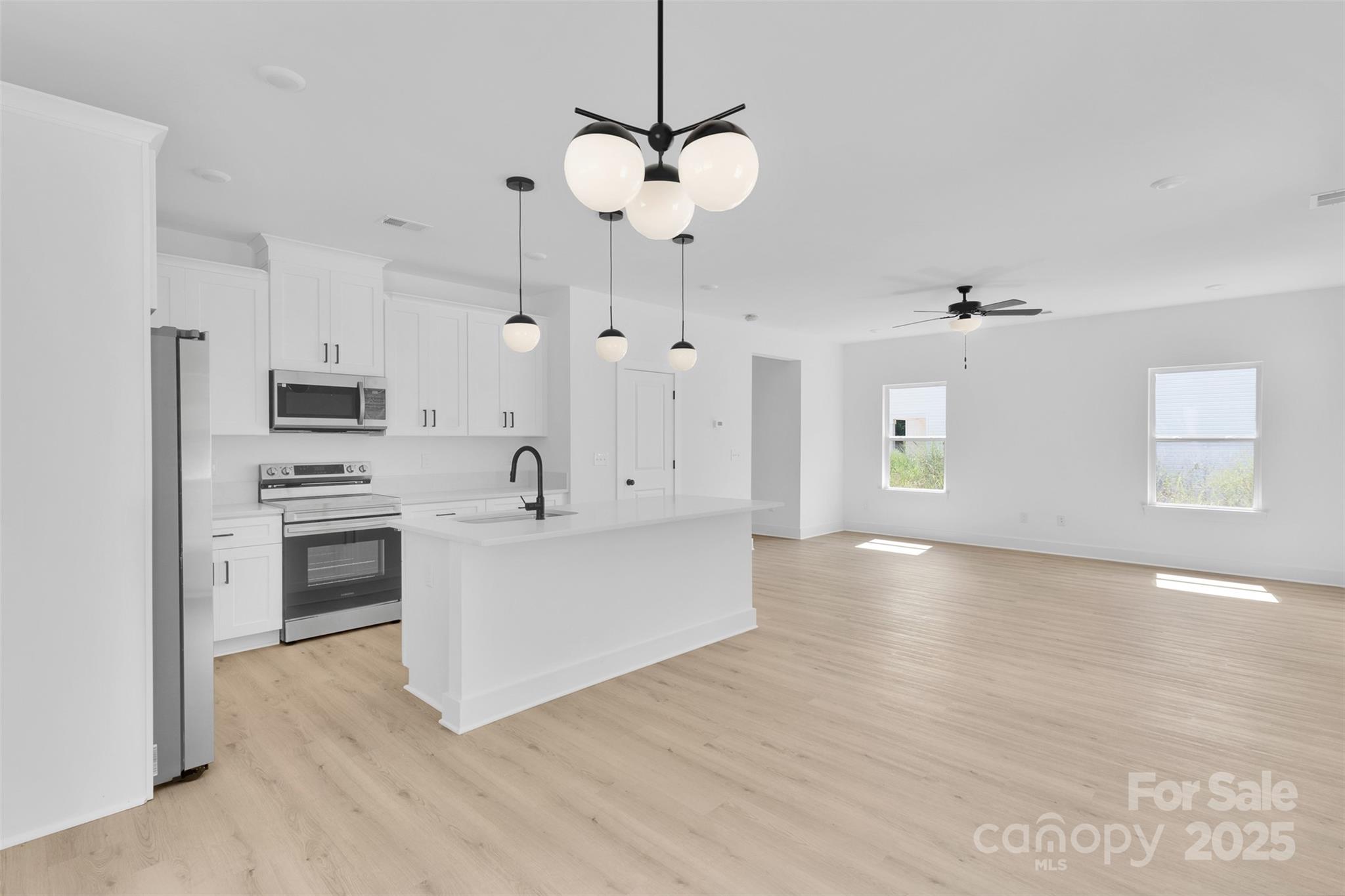 3549 Lake Road Charlotte, NC 28269 - Photo 11 of 34 a view of a kitchen with stove and cabinets