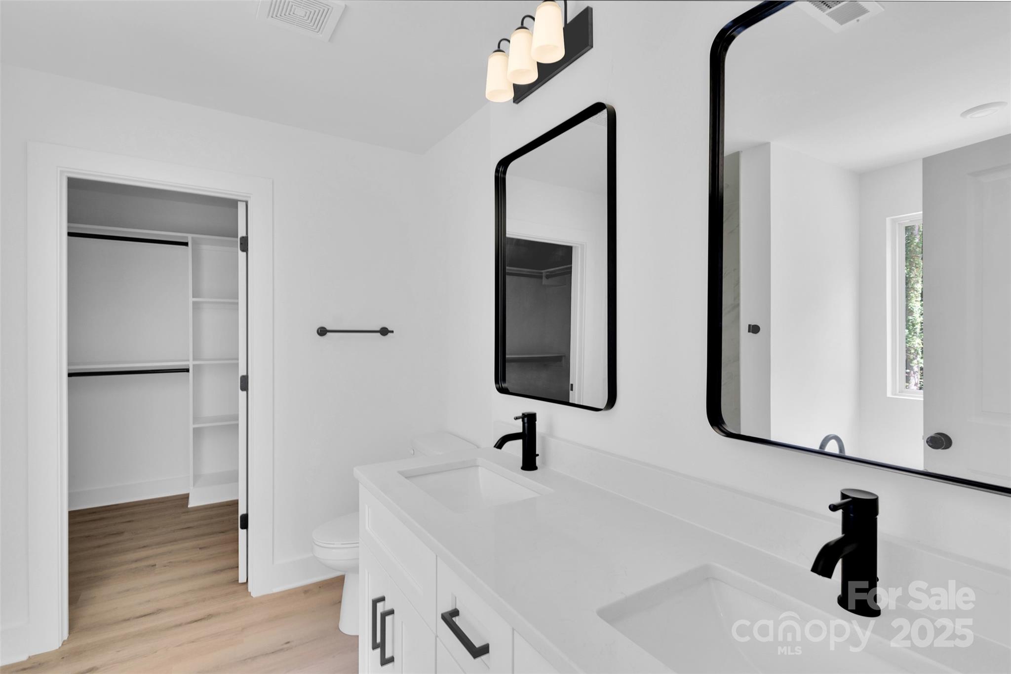 3549 Lake Road Charlotte, NC 28269 - Photo 17 of 34 a bathroom with a sink and a mirror