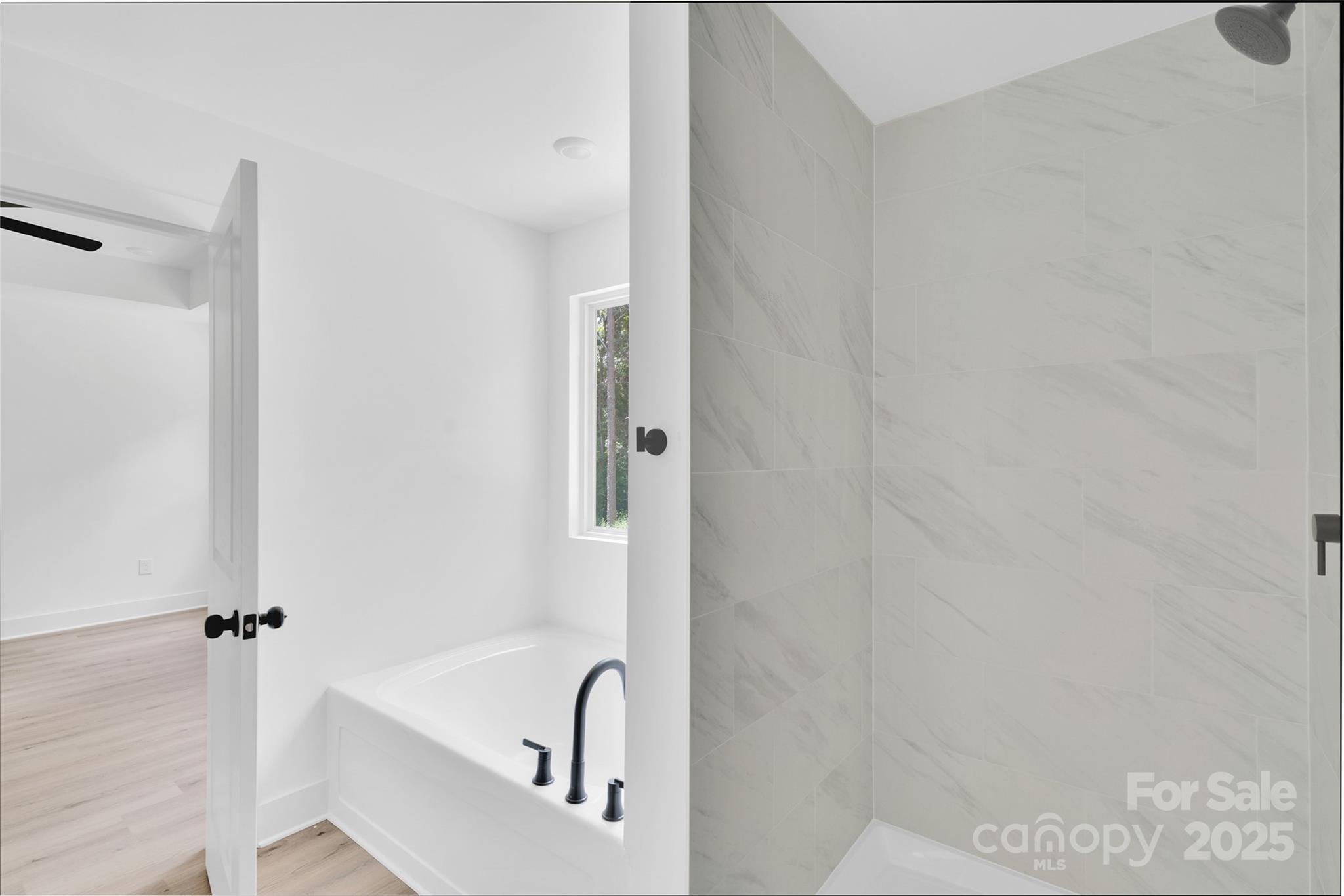 3549 Lake Road Charlotte, NC 28269 - Photo 18 of 34 a bathroom with a bathtub