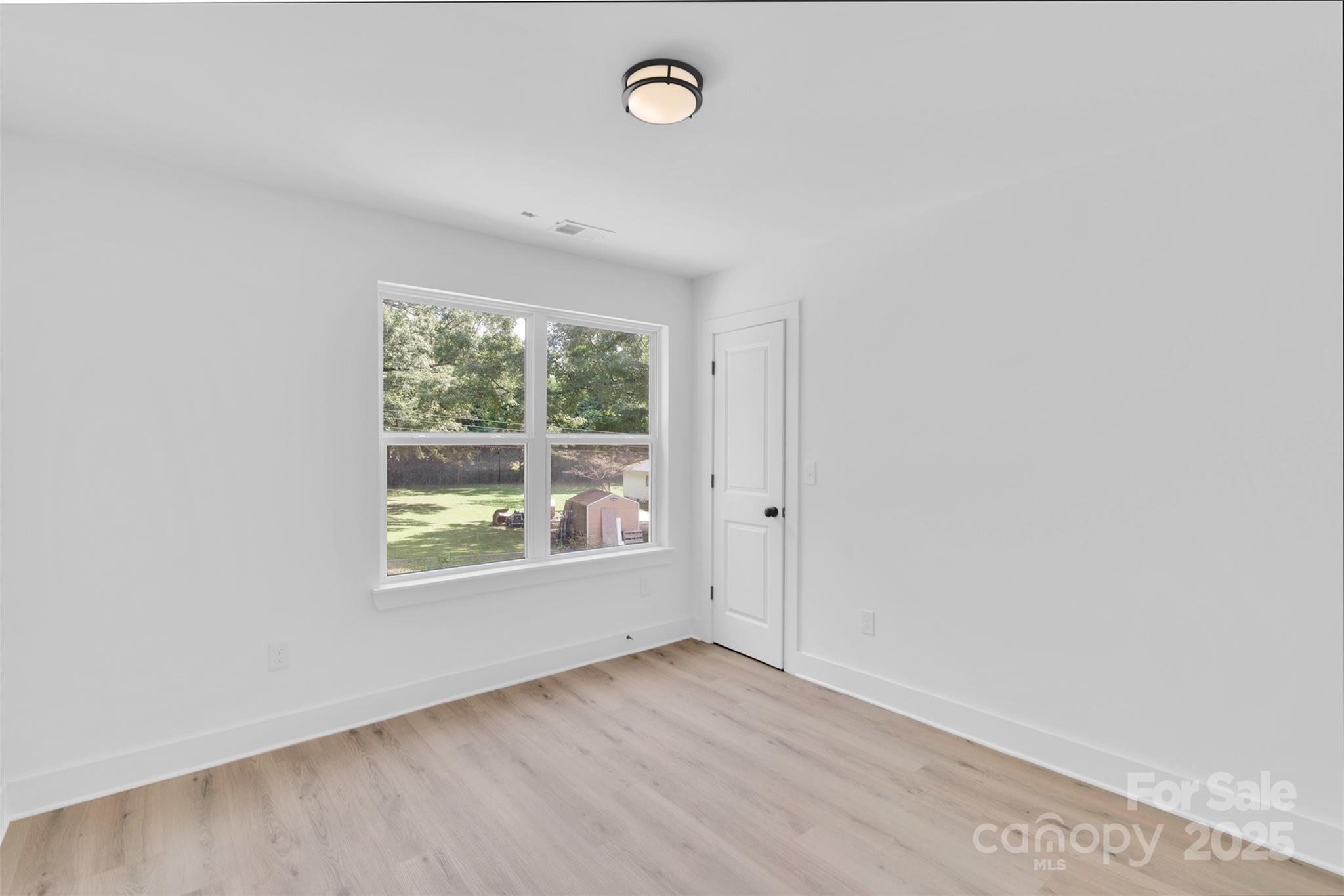 3549 Lake Road Charlotte, NC 28269 - Photo 20 of 34 a view of an empty room with a window