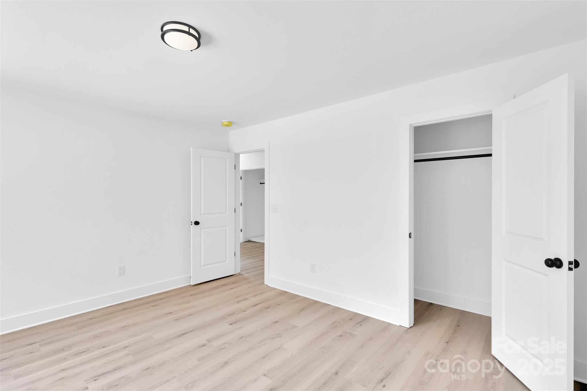 3549 Lake Road Charlotte, NC 28269 - Photo 23 of 34 a view of an empty room with wooden floor