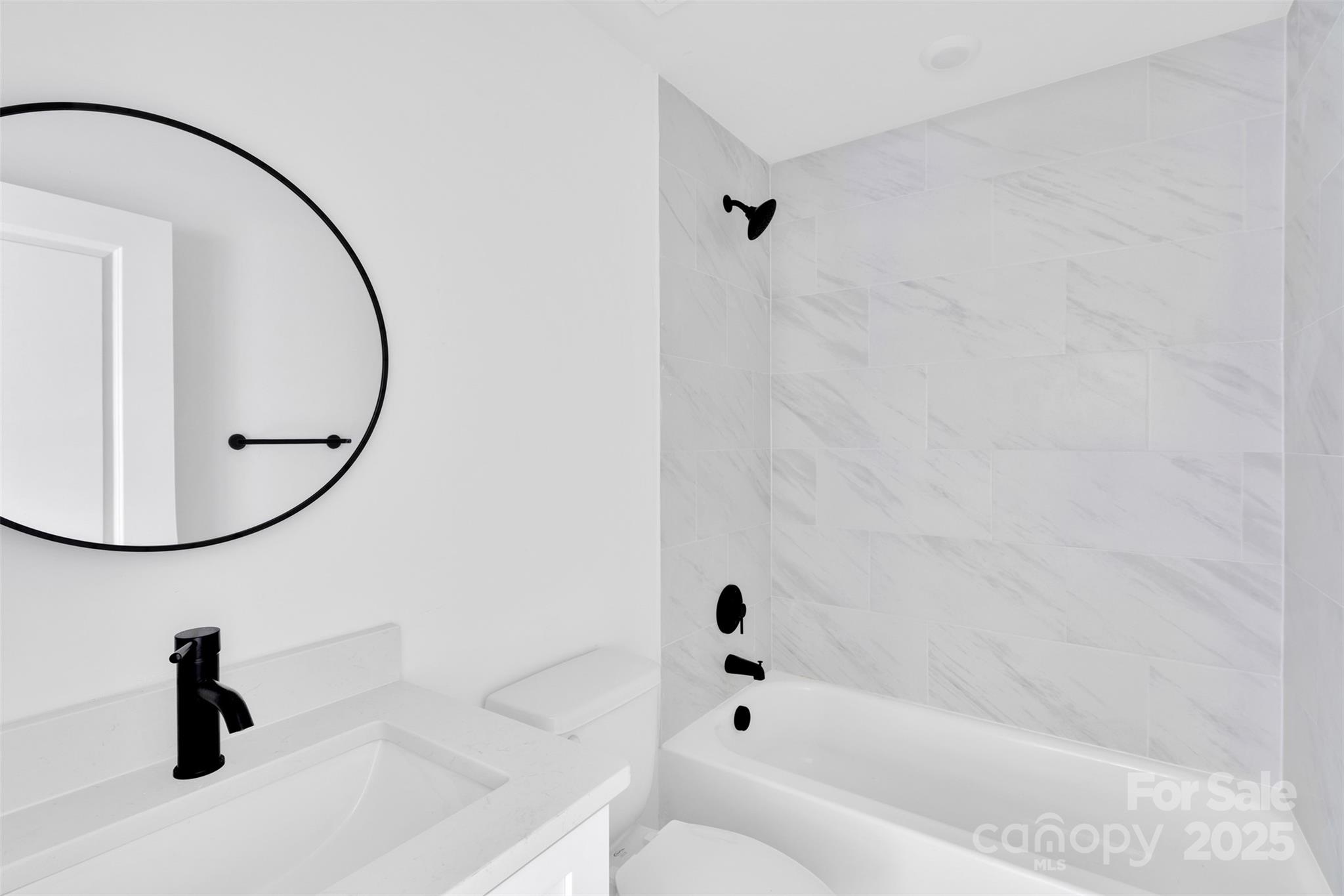 3549 Lake Road Charlotte, NC 28269 - Photo 26 of 34 a bathroom with a sink and a mirror