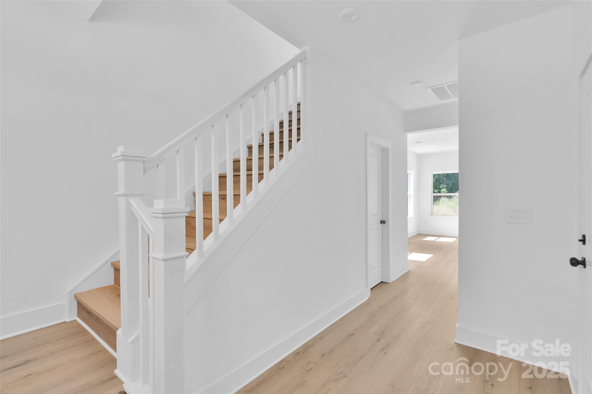 3549 Lake Road Charlotte, NC 28269 - Photo 6 of 34 a view of staircase with white walls and white walls