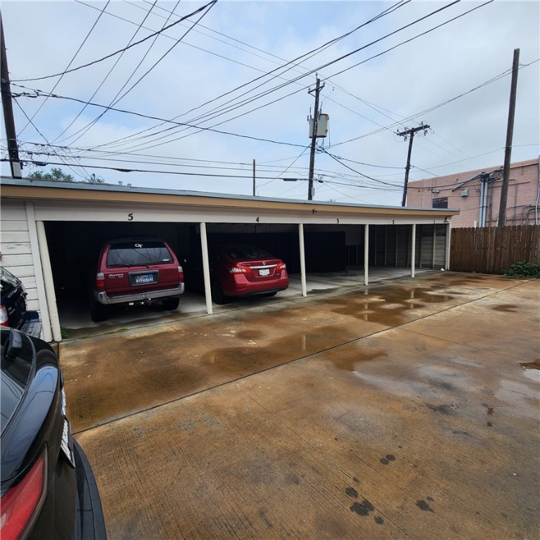 243 Indiana Avenue, Unit 5 Corpus Christi, TX 78404 - Photo 4 of 4 a front view of a car and garage