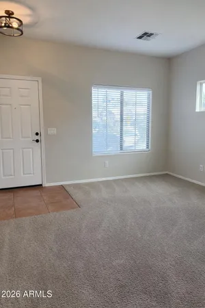 a view of an empty room with a window