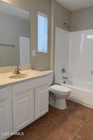 a bathroom with a sink a toilet and bathtub