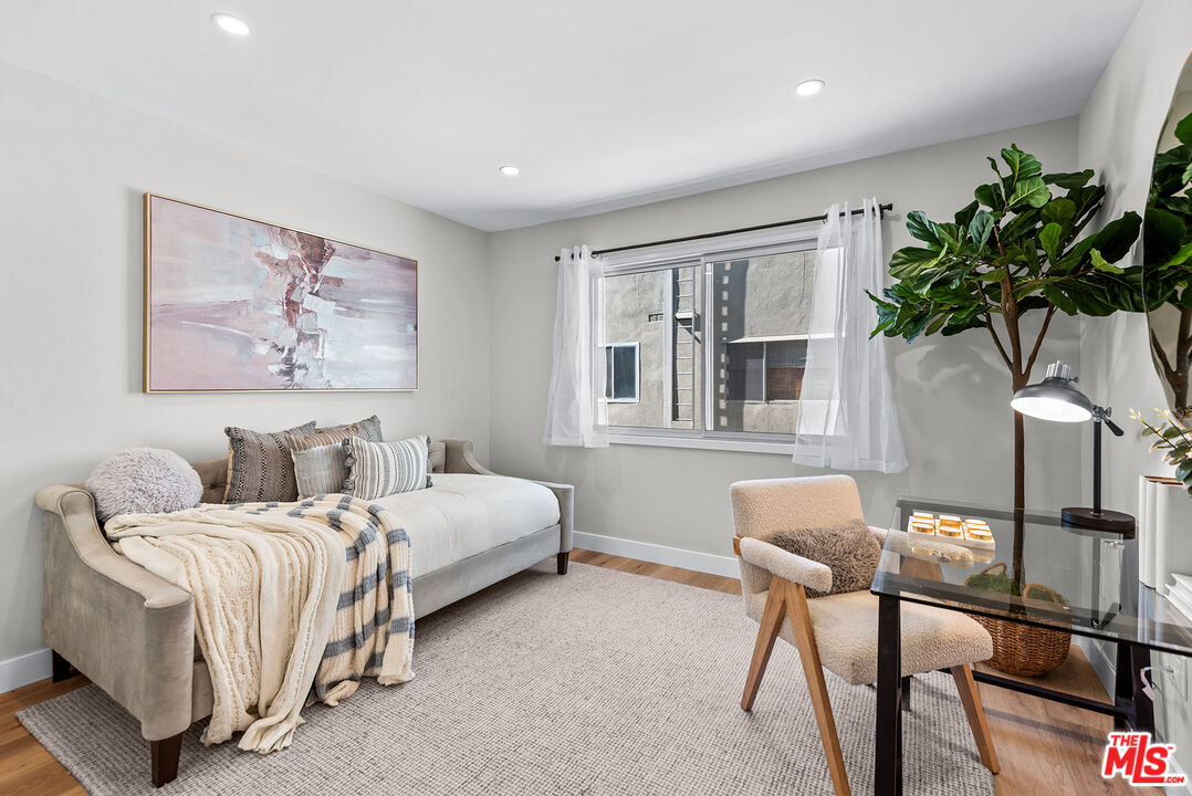 13135 Mindanao Way, Unit 5 Marina del Rey, CA 90292 - Photo 25 of 45 a bedroom with bed and a potted plant