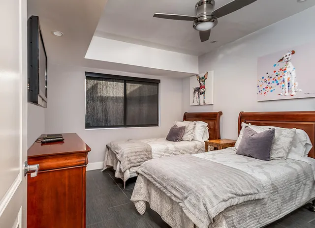 a bedroom with bed and a window