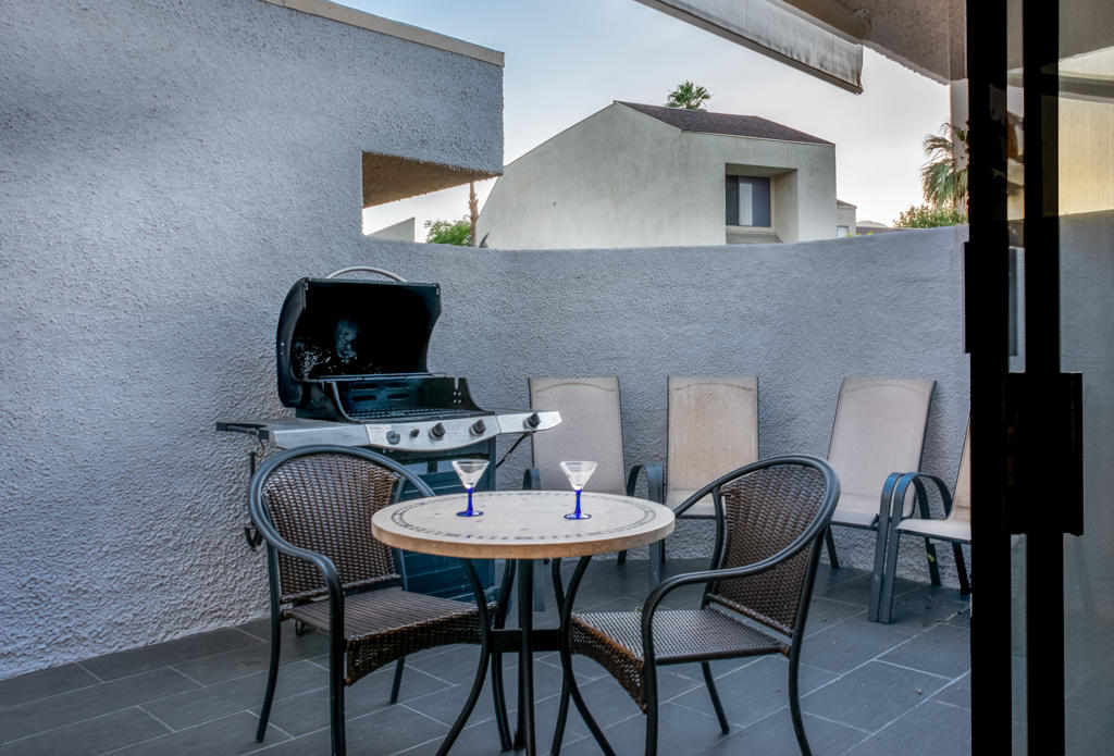 71863 Eleanora Lane Rancho Mirage, CA 92270 - Photo 20 of 24 a view of a dining room with furniture and wooden floor