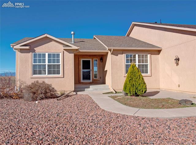 11601 Rio Secco Road Peyton, CO 80831 - Photo 3 of 36 Concrete Patio to Right of Front door gives nice area for a patio set and fire pit