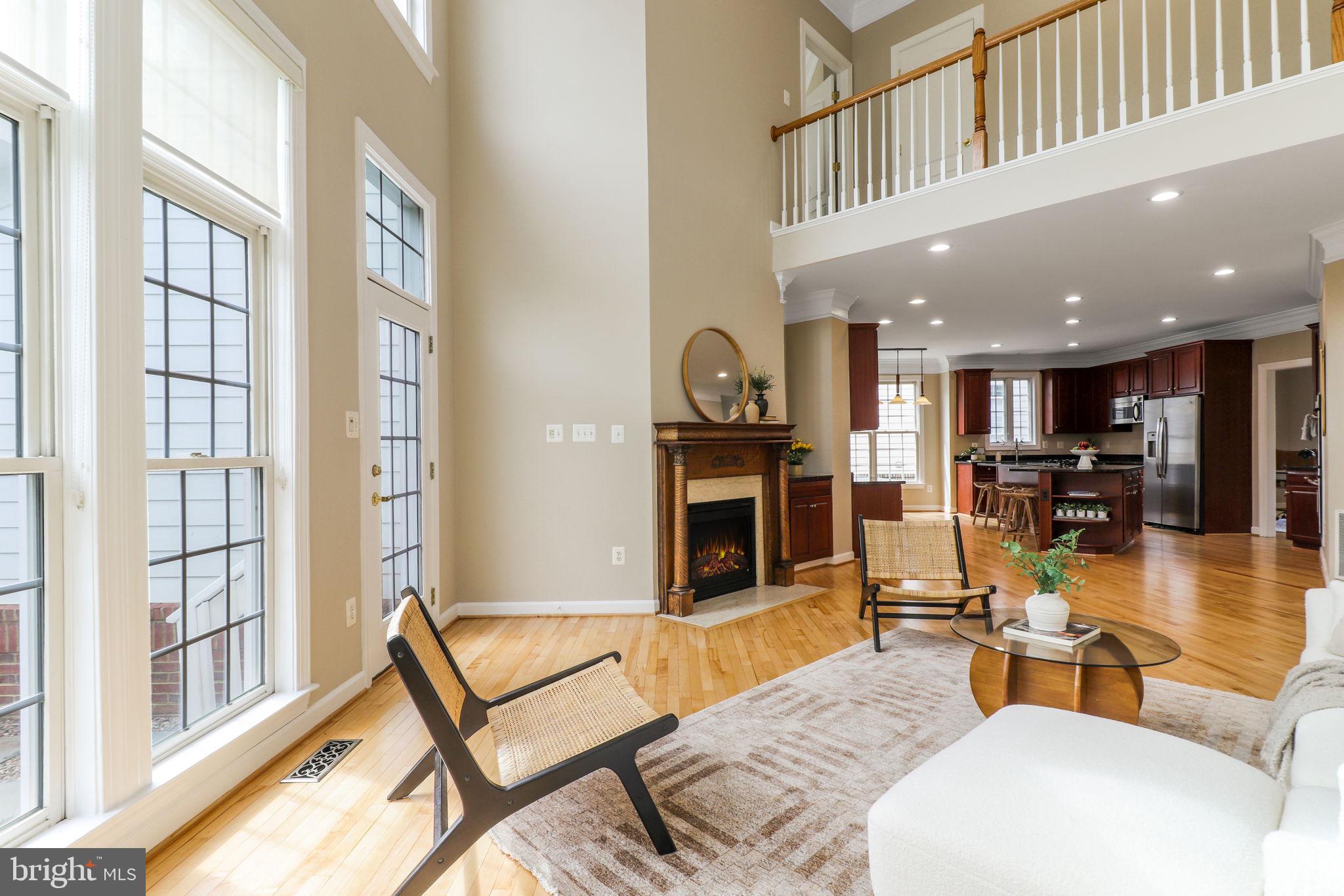 710 Crisfield Way Annapolis, MD 21401 - Photo 14 of 80 a living room with furniture a table and kitchen view