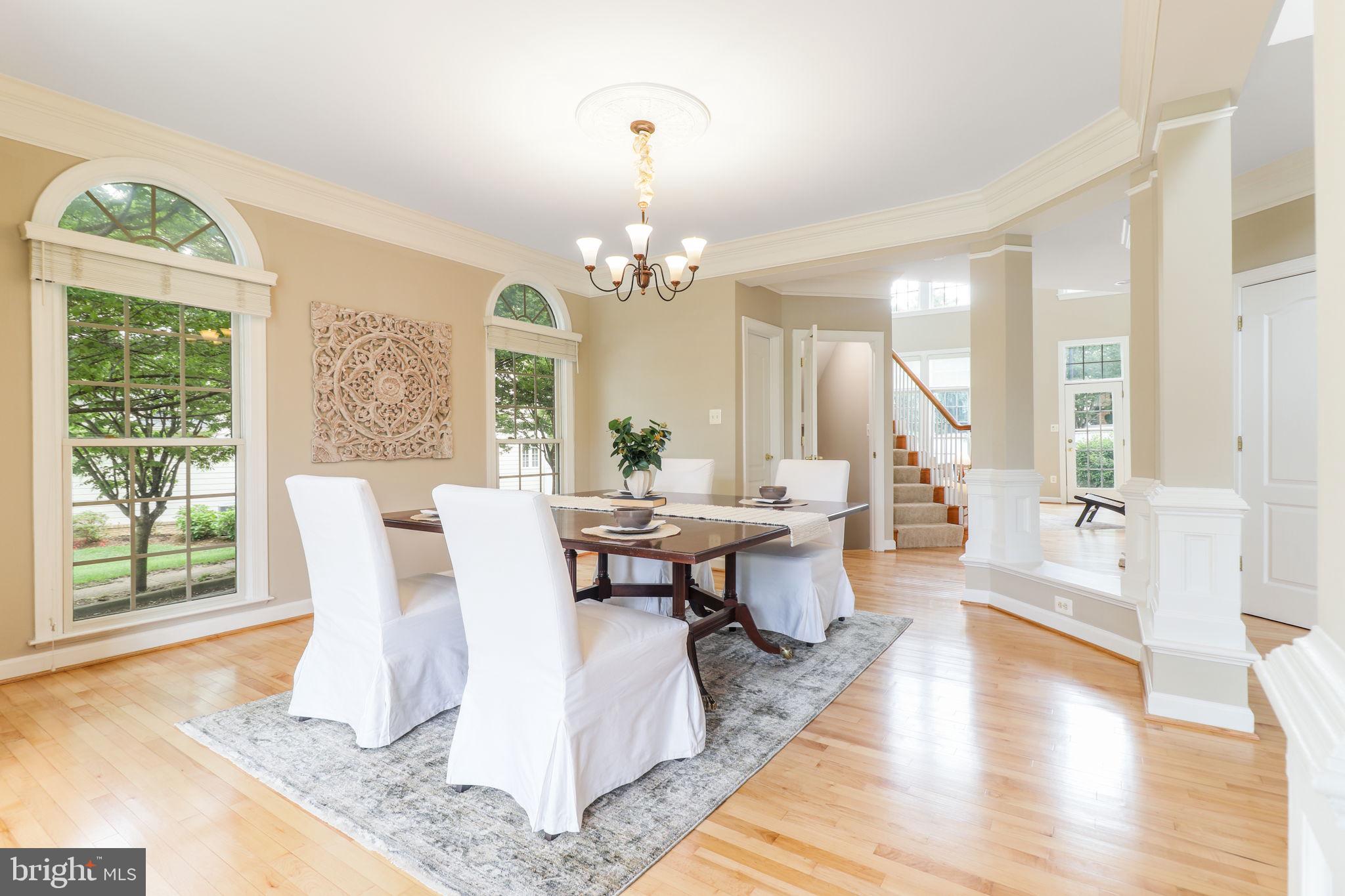 710 Crisfield Way Annapolis, MD 21401 - Photo 21 of 80 a living room with furniture a table and large windows