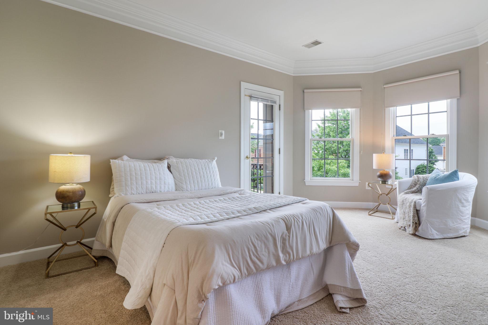 710 Crisfield Way Annapolis, MD 21401 - Photo 27 of 80 a bedroom with a bed and large windows