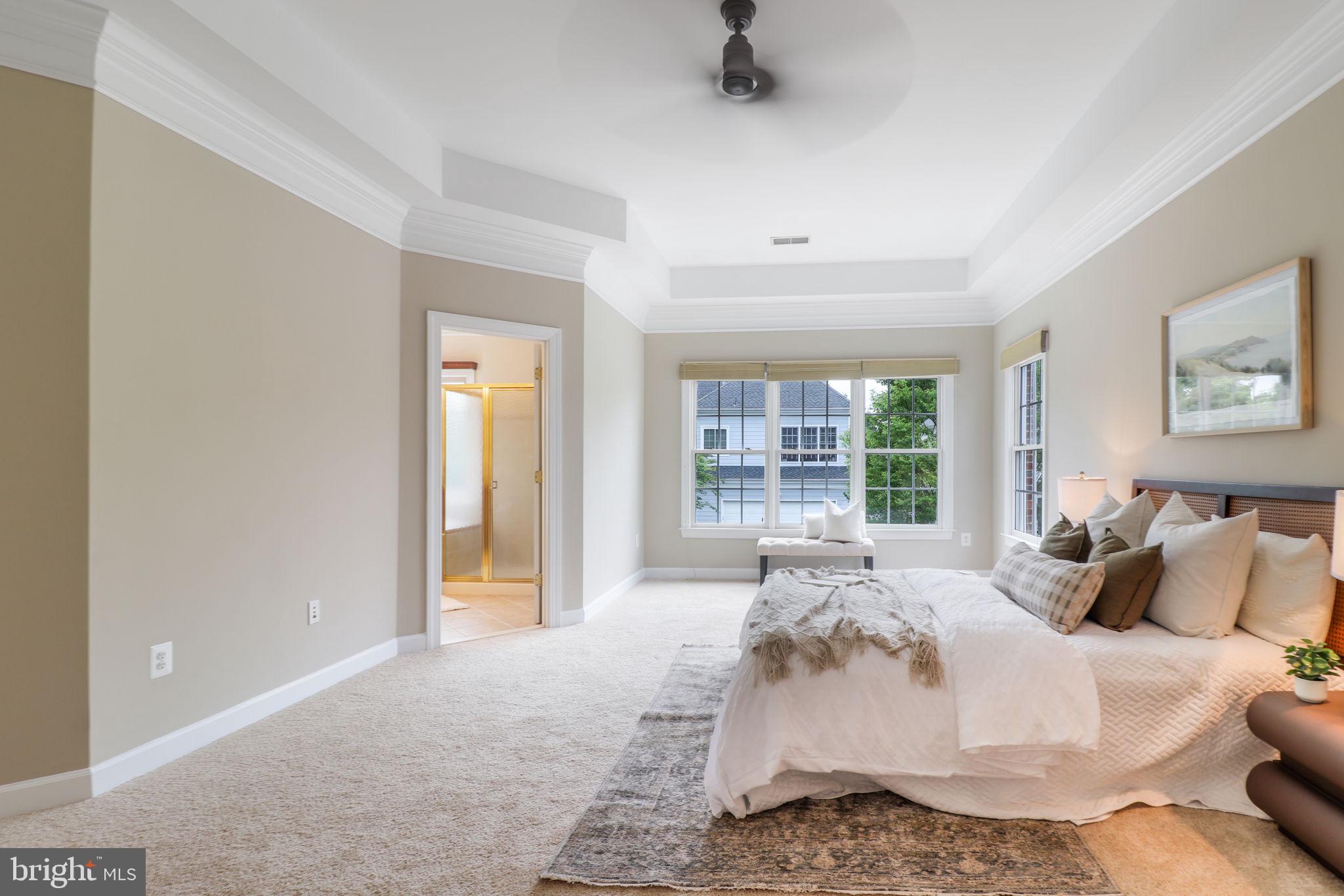 710 Crisfield Way Annapolis, MD 21401 - Photo 30 of 80 a large white bed sitting in a bedroom next to a window