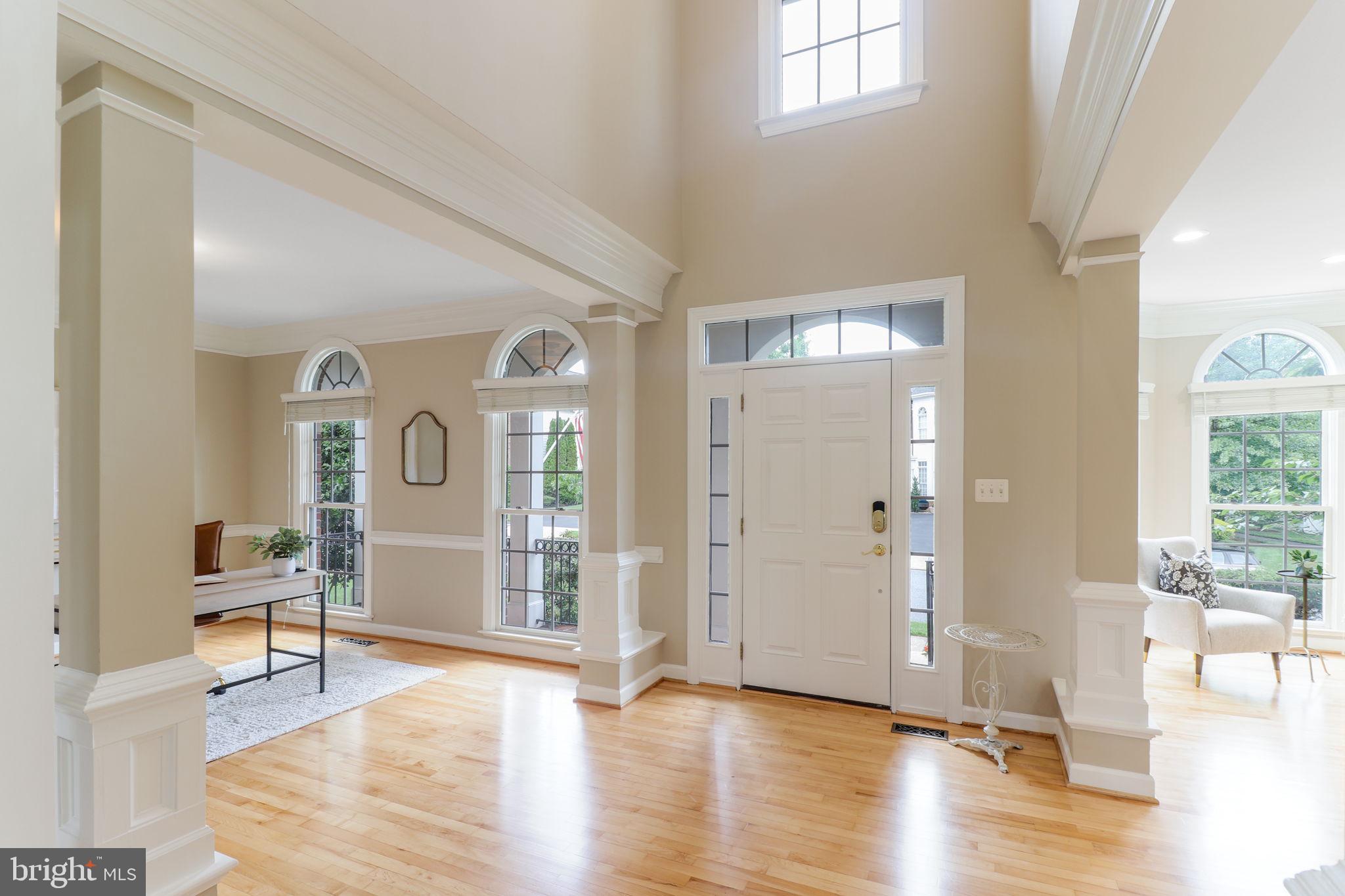 710 Crisfield Way Annapolis, MD 21401 - Photo 3 of 80 a view of a livingroom with wooden floor and a dining table