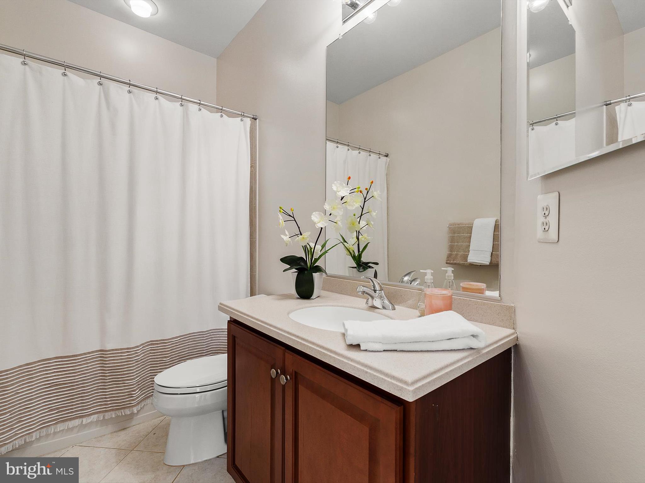 710 Crisfield Way Annapolis, MD 21401 - Photo 44 of 80 a bathroom with a sink and a mirror