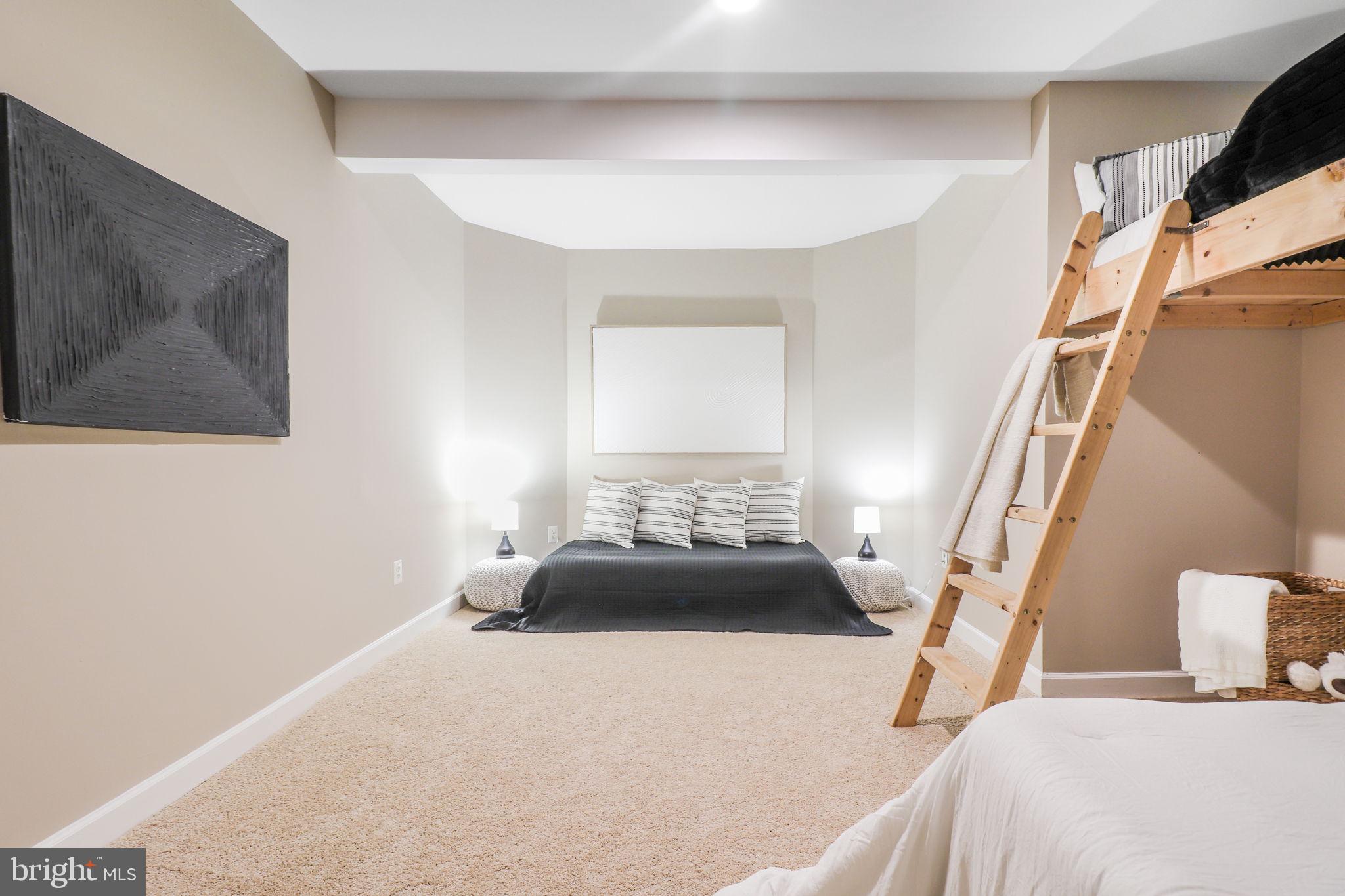 710 Crisfield Way Annapolis, MD 21401 - Photo 47 of 80 a bedroom with a bed and a painting on the wall