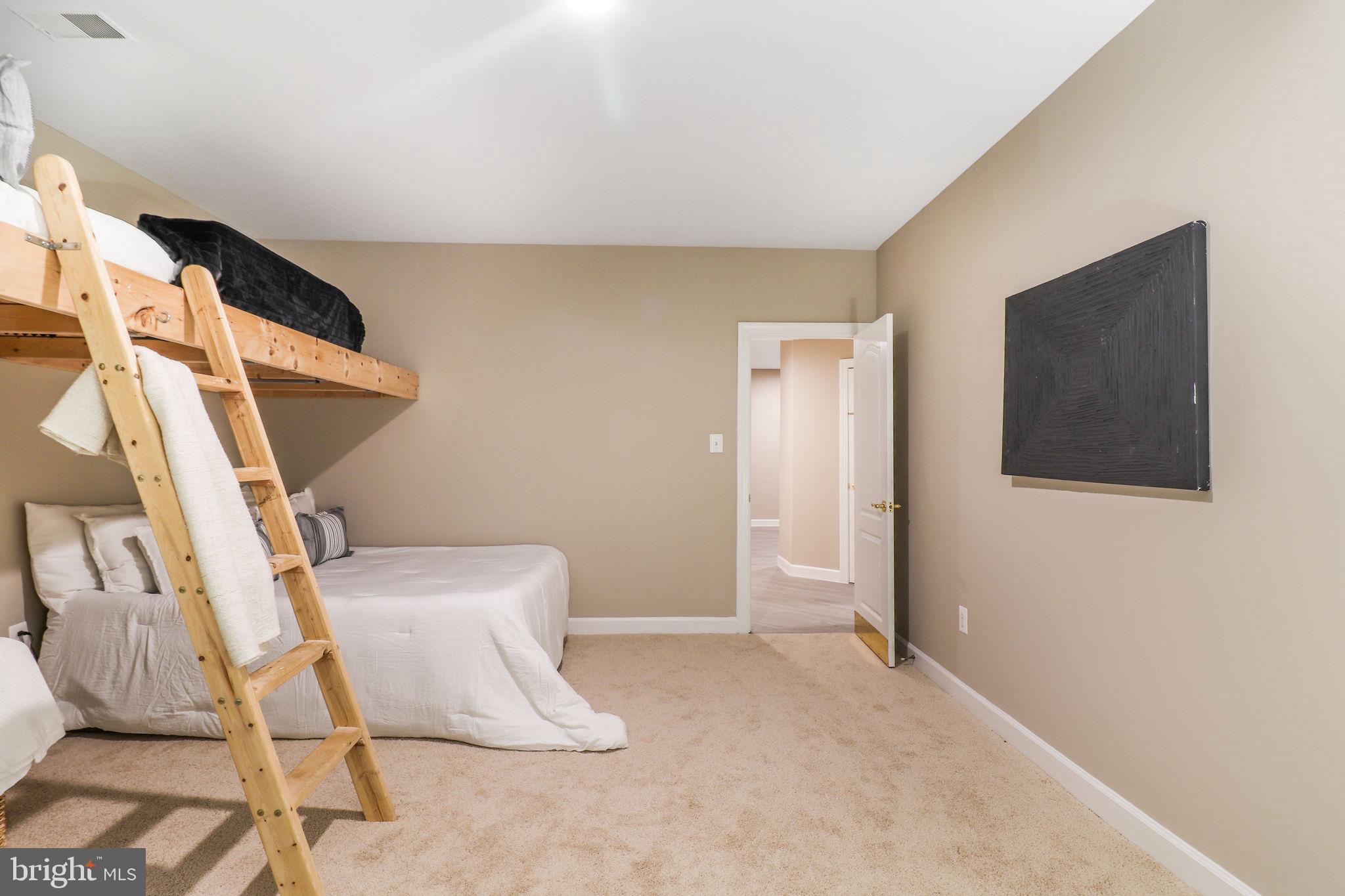 710 Crisfield Way Annapolis, MD 21401 - Photo 49 of 80 a view of an empty room with wooden floor and a window