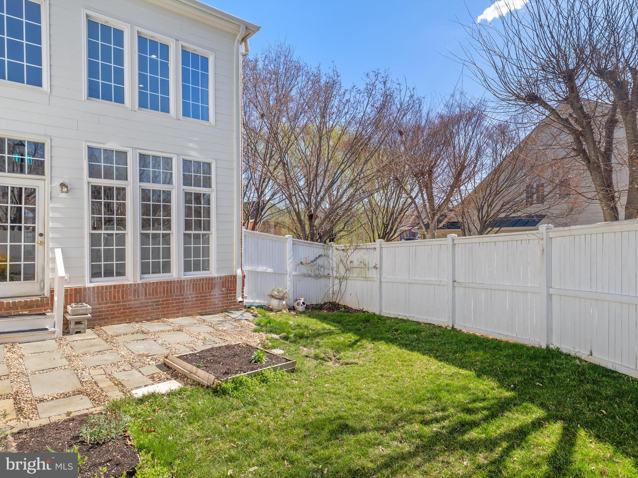 710 Crisfield Way Annapolis, MD 21401 - Photo 59 of 80 a front view of a house with a yard and garage