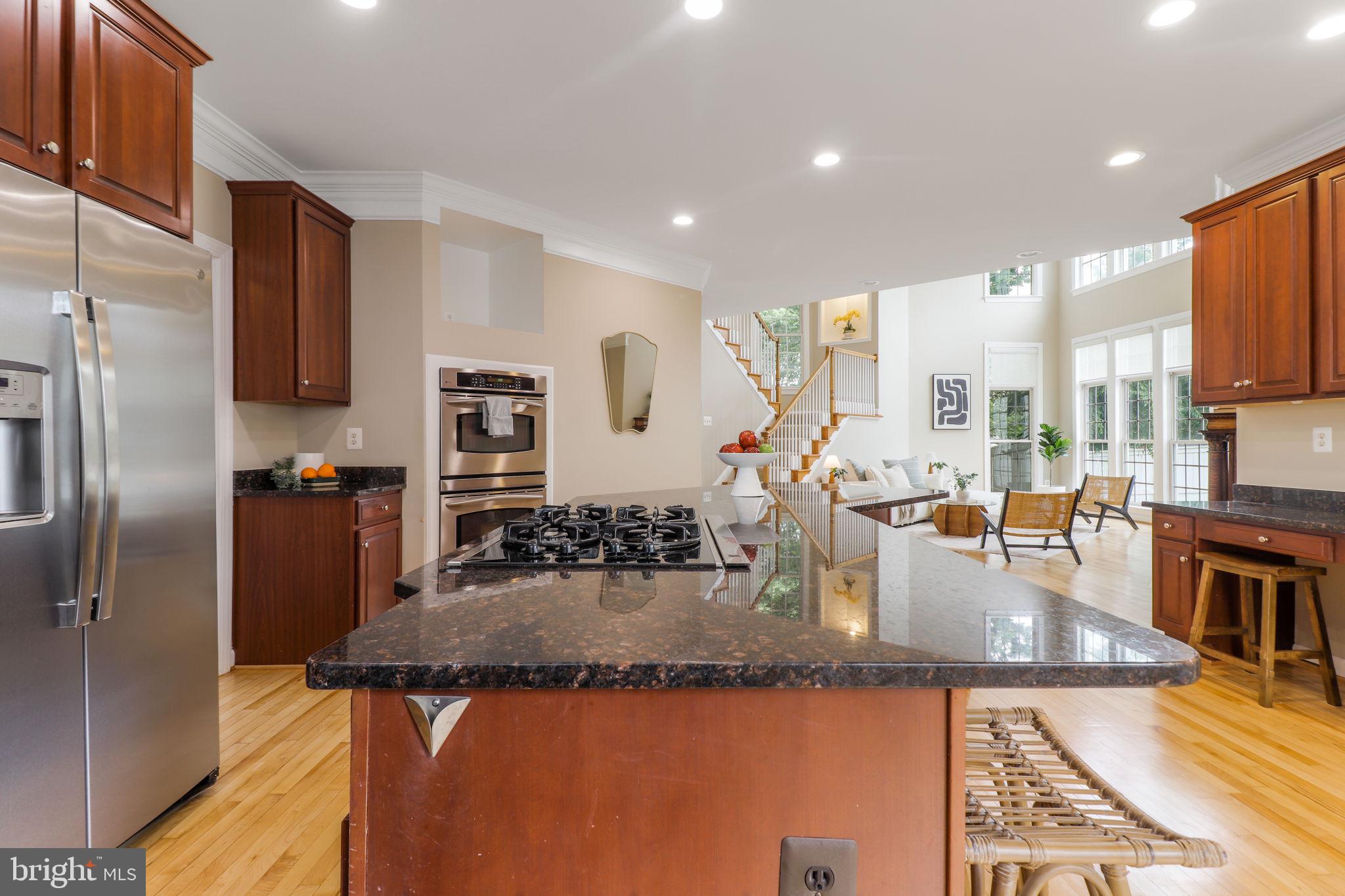710 Crisfield Way Annapolis, MD 21401 - Photo 7 of 80 a kitchen with granite countertop a sink a counter top stainless steel appliances and cabinets