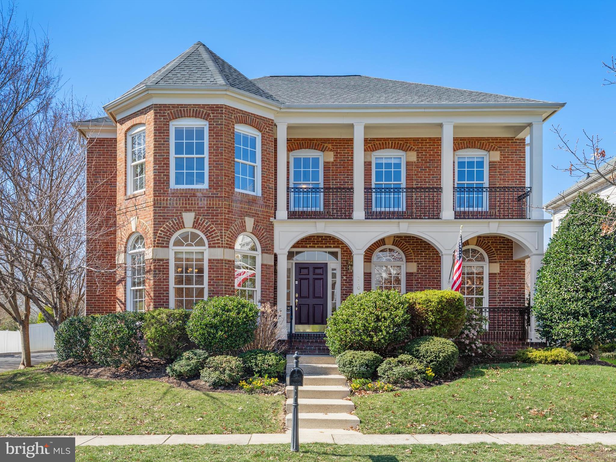 710 Crisfield Way Annapolis, MD 21401 - Photo 75 of 80 front view of a brick house with a yard