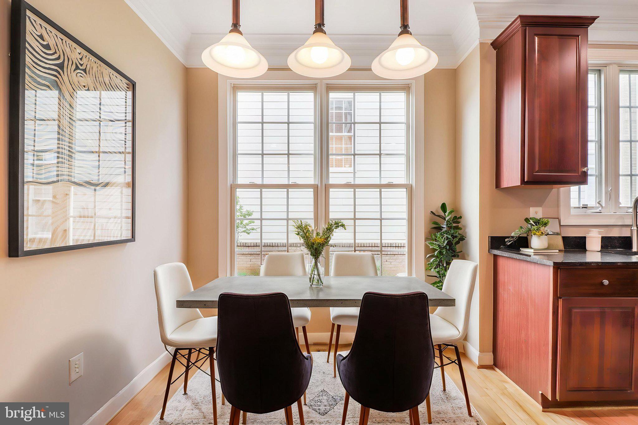 710 Crisfield Way Annapolis, MD 21401 - Photo 10 of 80 a view of a dining room with furniture and windows