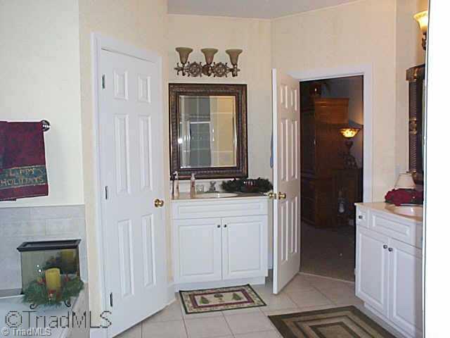 1505 Whites Mill Road High Point, NC 27265 - Photo 7 of 16 Other. Master Bath has soaking tub with beautiful tile work,seperate shower, walk-in closet, two vanities and a large window for loads of natural light