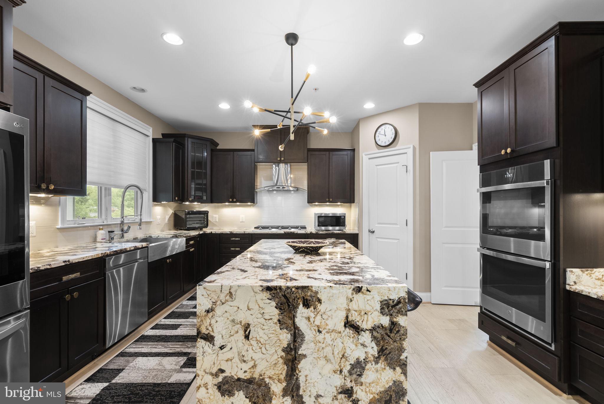 4702 Edgefield Road Bethesda, MD 20814 - Photo 15 of 58 Sleek kitchen with elegant finishes.