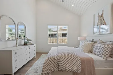 a bedroom with bed and a window