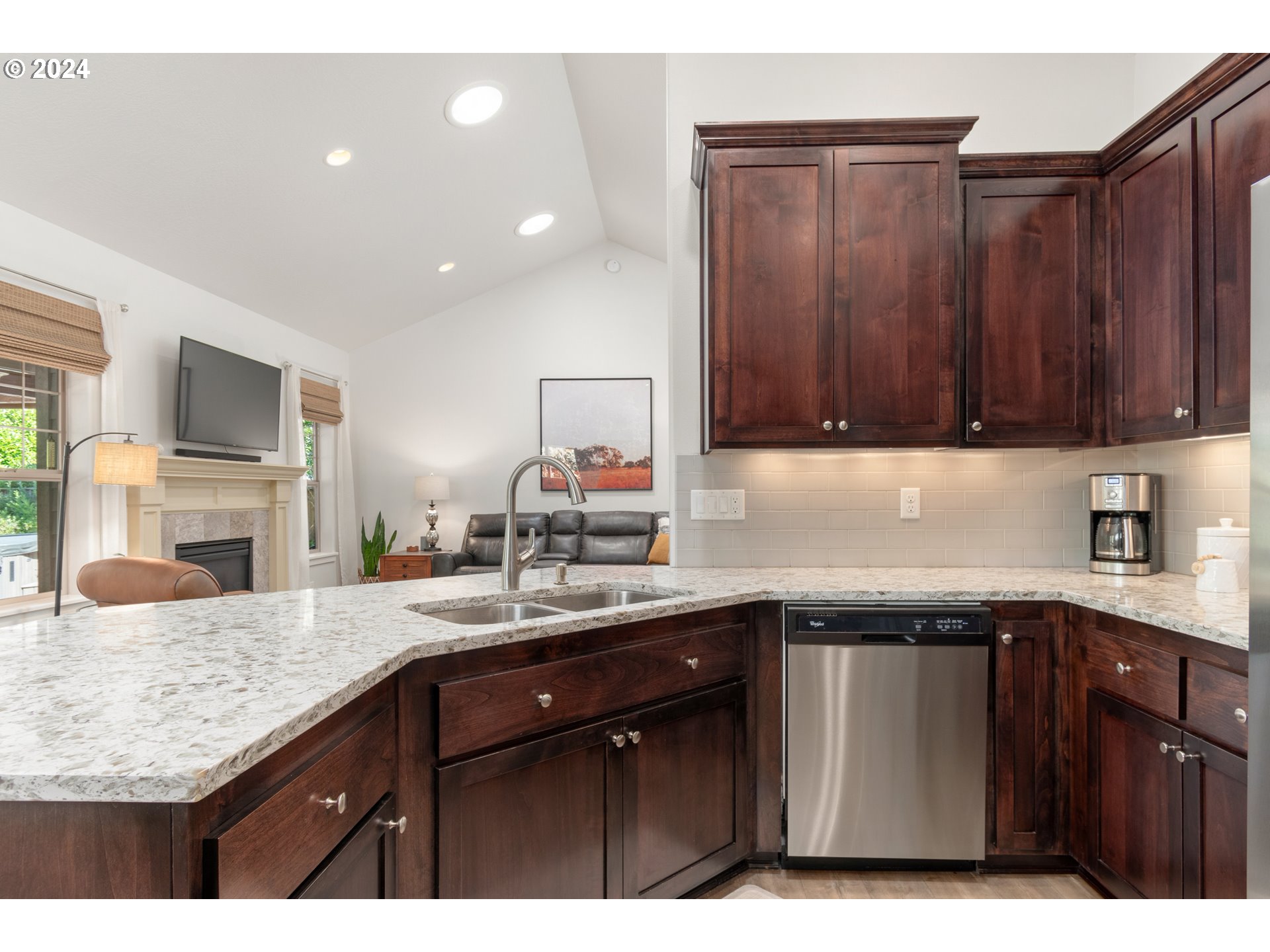 3622 Stark Street Eugene, OR 97404 - Photo 11 of 48 a kitchen with a sink dishwasher a stove and cabinets