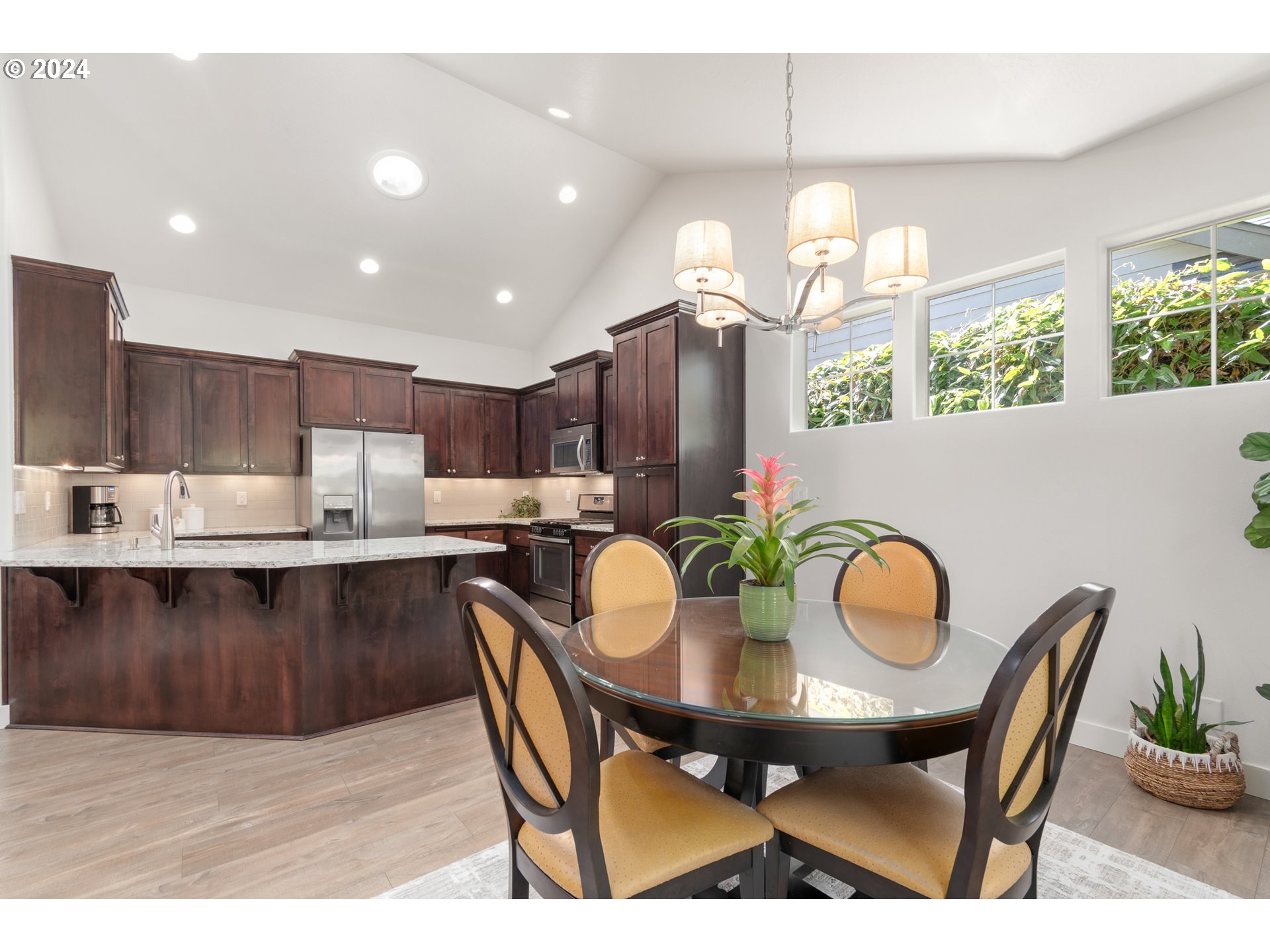 3622 Stark Street Eugene, OR 97404 - Photo 14 of 48 a view of a dining room with furniture window and wooden floor