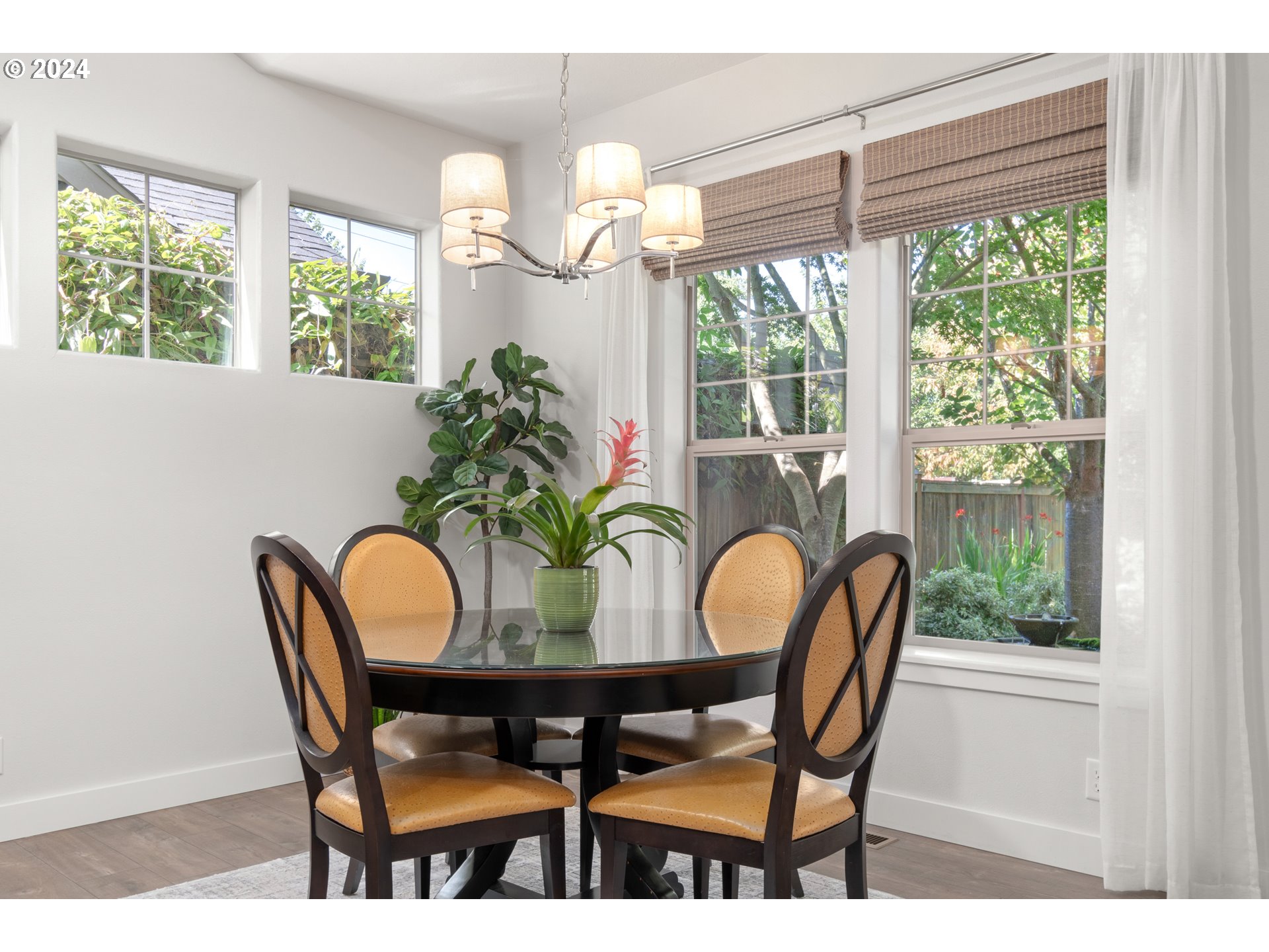 3622 Stark Street Eugene, OR 97404 - Photo 15 of 48 a dining room with furniture a large window and a chandelier