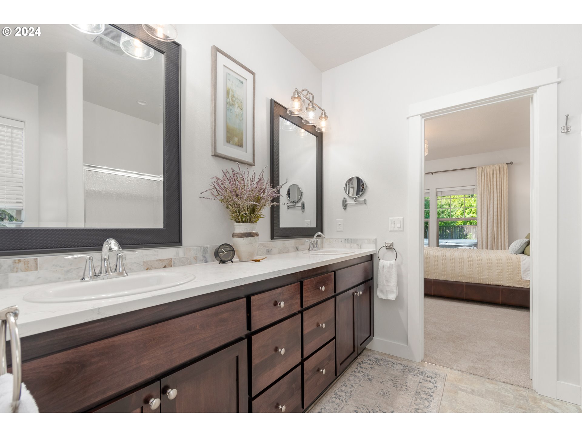 3622 Stark Street Eugene, OR 97404 - Photo 19 of 48 a en suite bathroom with a double vanity sink a mirror and a shower