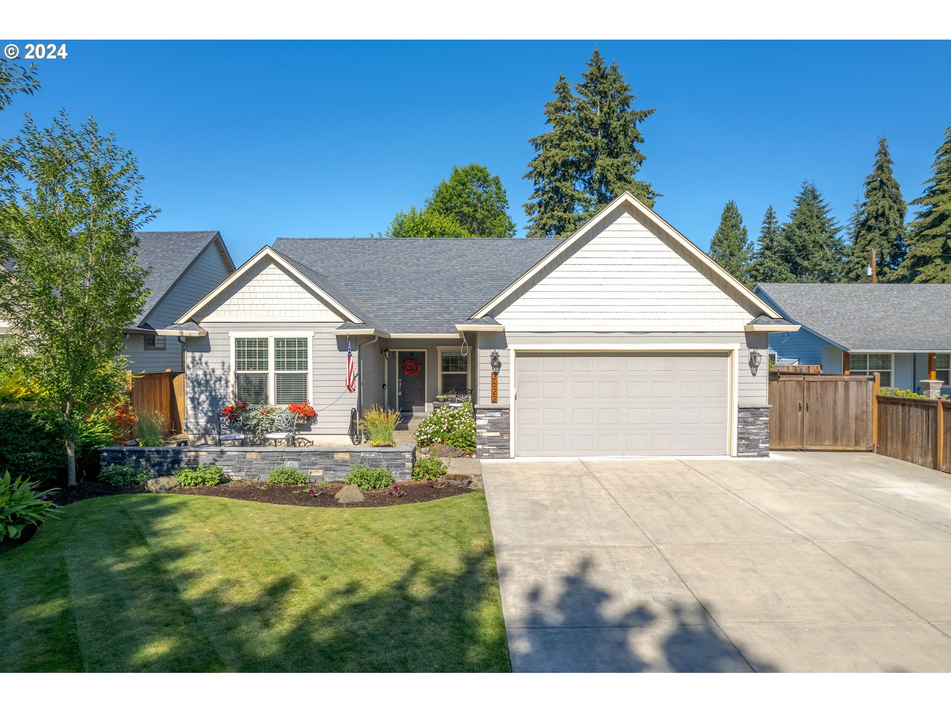 3622 Stark Street Eugene, OR 97404 - Photo 2 of 48 a front view of a house with a yard and garage