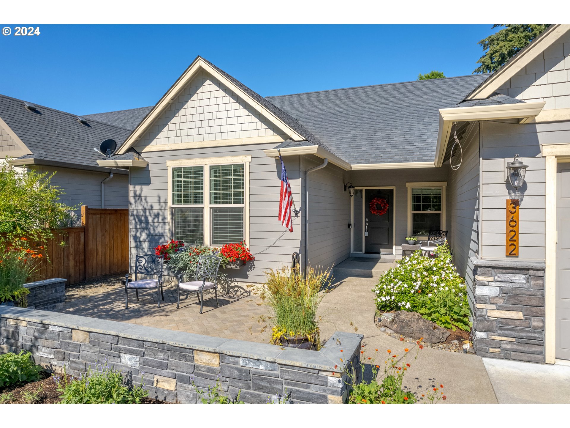3622 Stark Street Eugene, OR 97404 - Photo 3 of 48 a front view of a house with garden