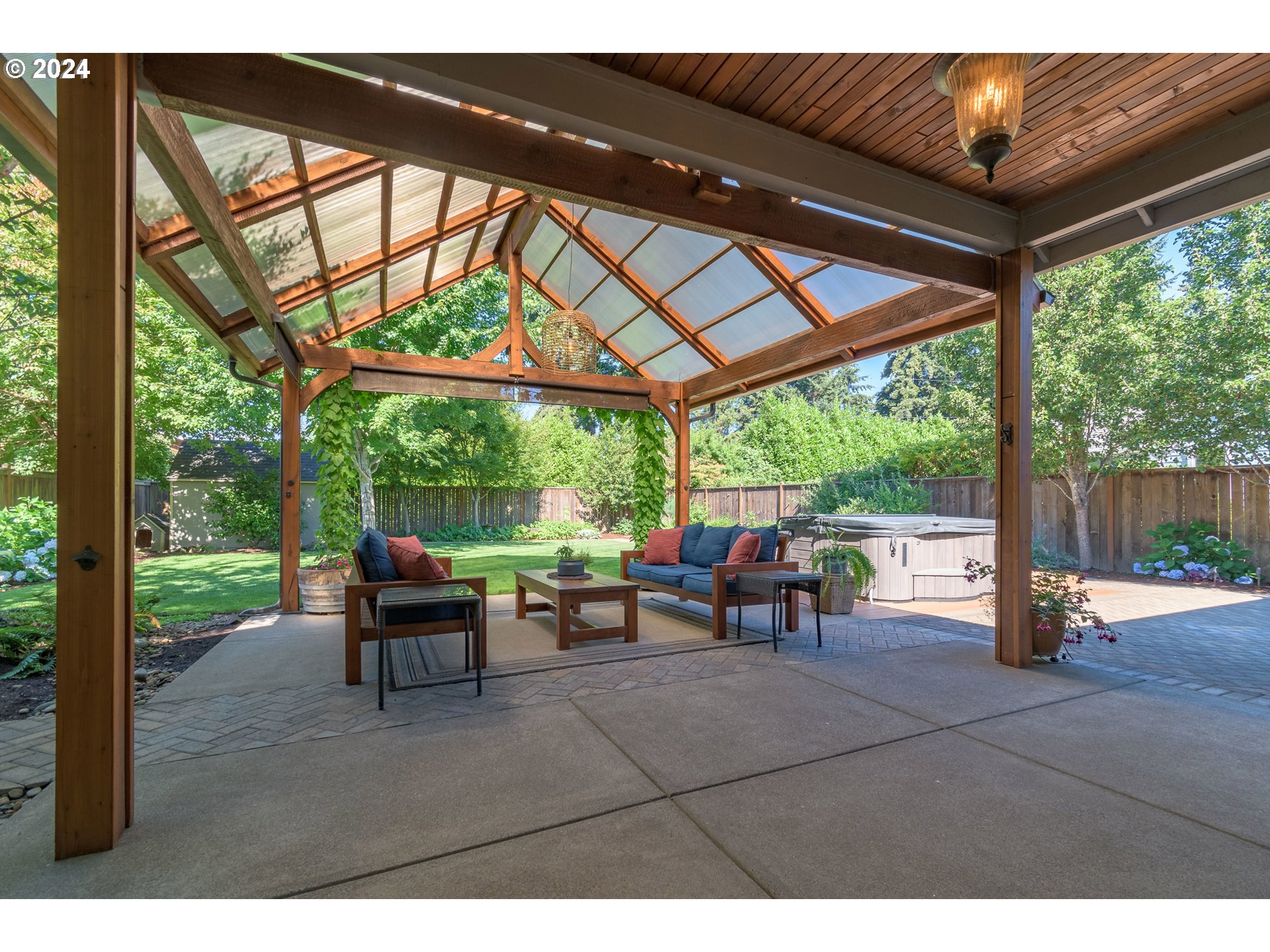 3622 Stark Street Eugene, OR 97404 - Photo 32 of 48 a view of a patio with table and chairs potted plants with wooden floor and fence