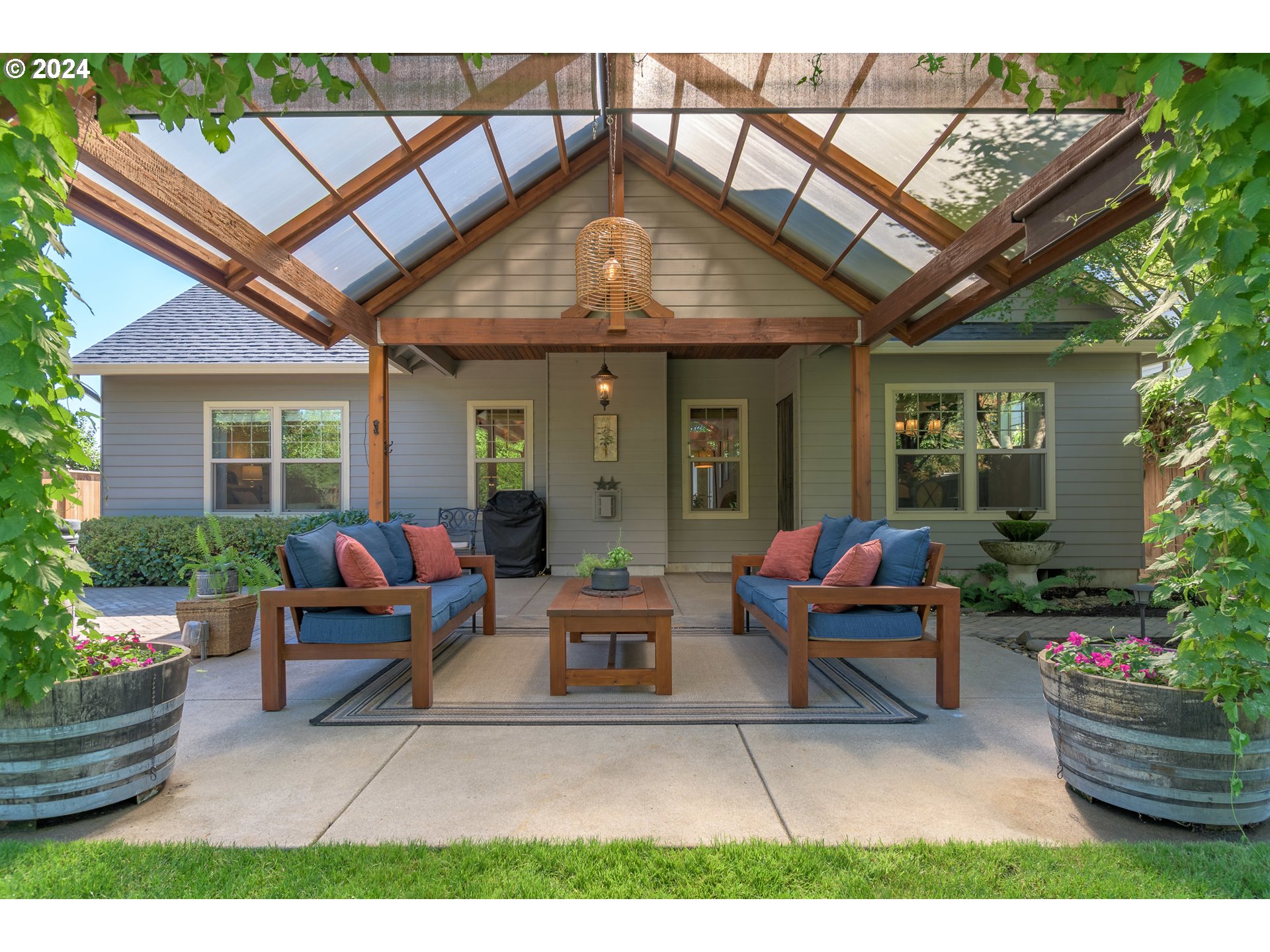 3622 Stark Street Eugene, OR 97404 - Photo 34 of 48 a view of an house with backyard sitting area and garden