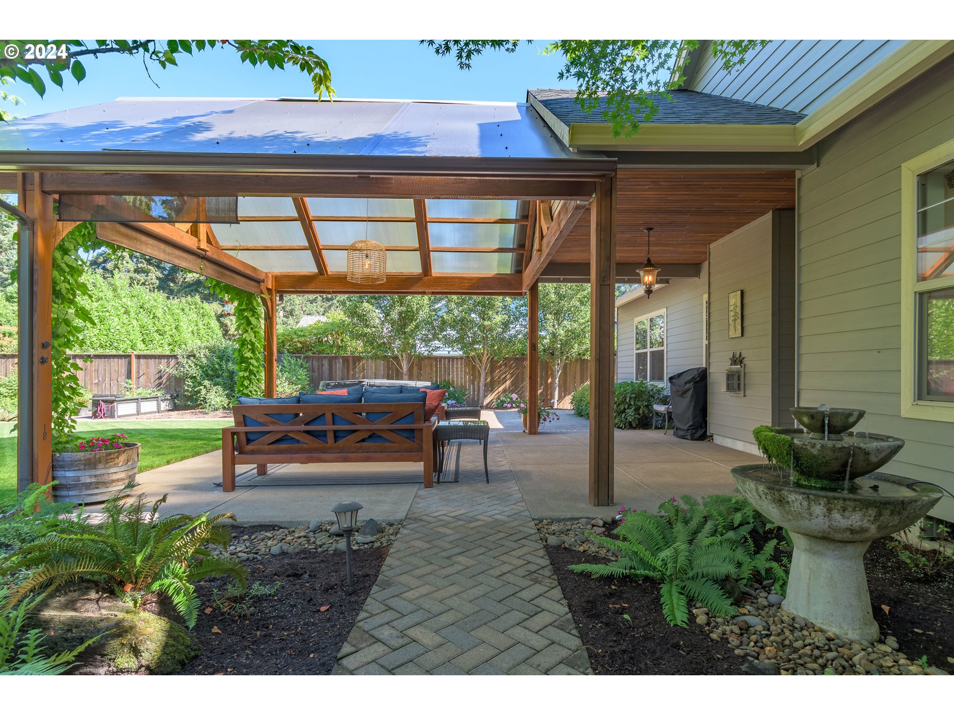 3622 Stark Street Eugene, OR 97404 - Photo 38 of 48 a view of a patio with table and chairs potted plants with wooden floor