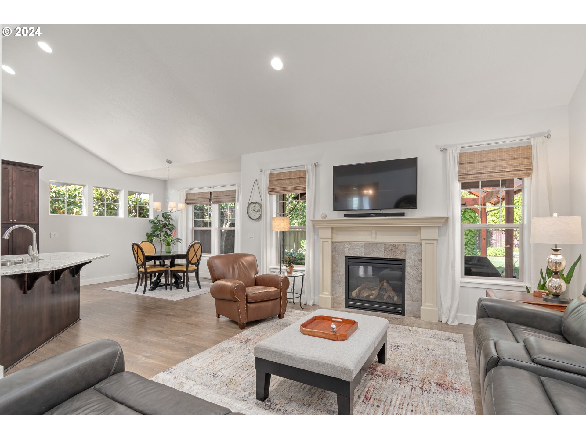 3622 Stark Street Eugene, OR 97404 - Photo 5 of 48 a living room with furniture a fireplace with wooden floor