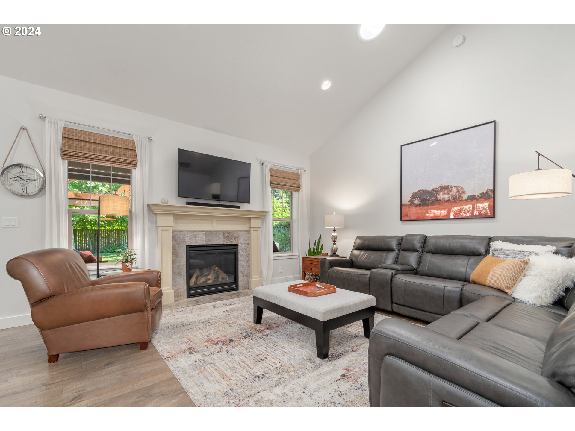 3622 Stark Street Eugene, OR 97404 - Photo 6 of 48 a living room with furniture a fireplace and a flat screen tv