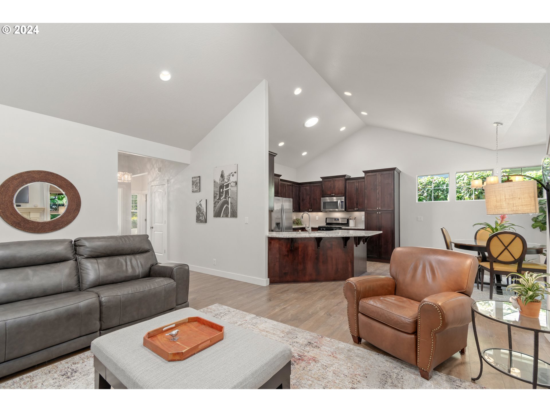 3622 Stark Street Eugene, OR 97404 - Photo 8 of 48 a living room with furniture a rug and kitchen view